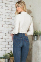 Andante USA women's form-fitting travel bodysuit in white, perfect for chic travel outfits