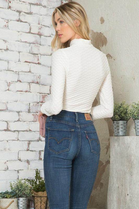 Andante USA women's form-fitting travel bodysuit in white, perfect for chic travel outfits