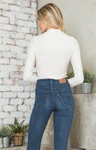 Andante USA Women's form-fitting travel bodysuit in white for stylish comfort on the go