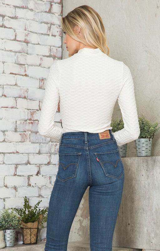 Andante USA Women's form-fitting travel bodysuit in white for stylish comfort on the go