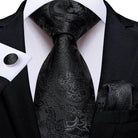Black paisley formal neck tie for men with matching pocket square and cufflinks for elegant occasions