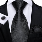 Black paisley formal neck tie for men paired with a matching pocket square and cufflink