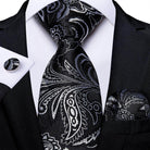 Elegant black paisley formal neck tie for men with matching pocket square and cufflinks