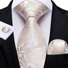 Elegant beige formal neck tie for men featuring intricate paisley patterns and coordinated pocket square