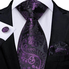 Elegant black and purple paisley formal neck tie for men, paired with matching pocket square and cufflinks