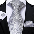 Elegant silver paisley formal neck tie for men with matching pocket square and cufflinks