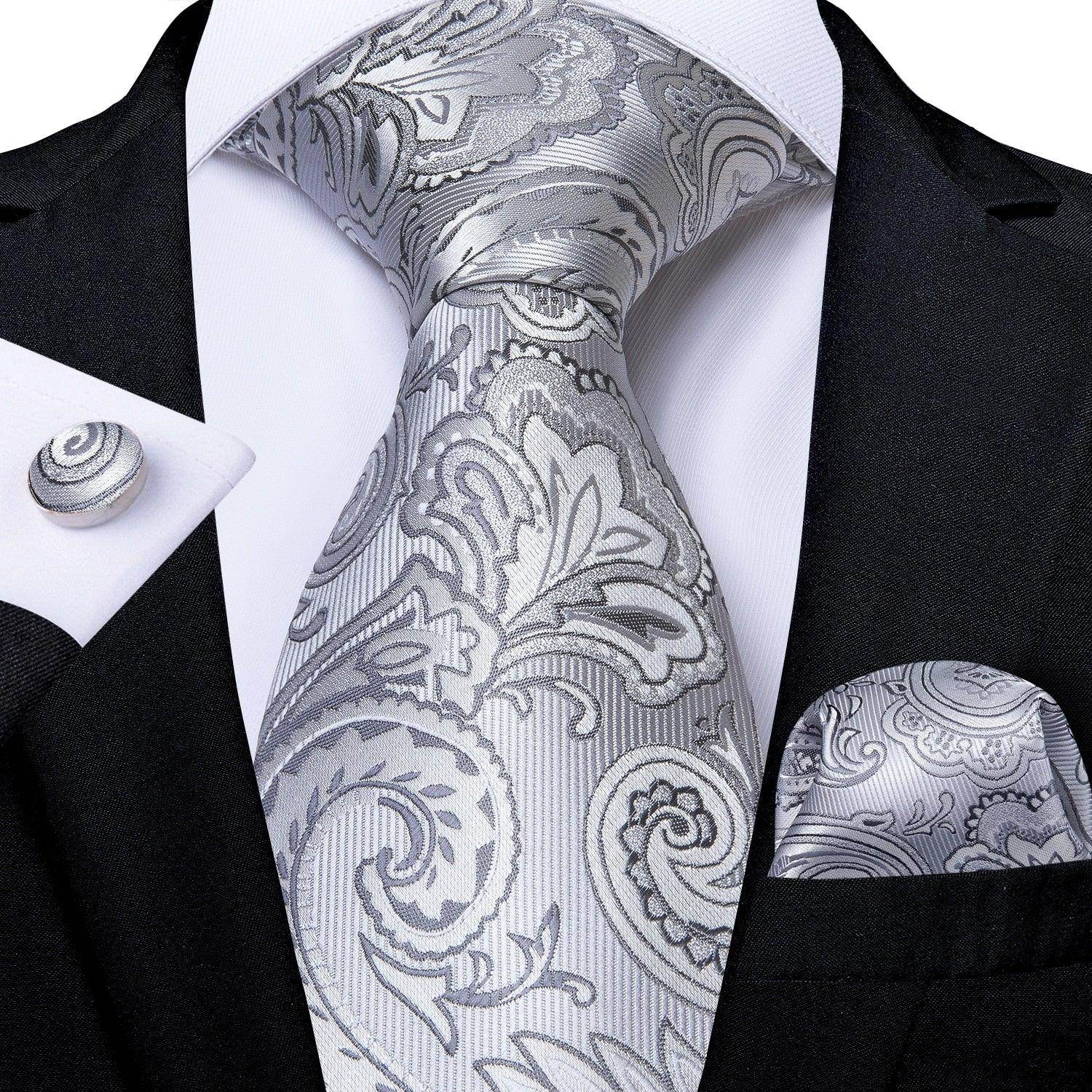 Elegant silver paisley formal neck tie for men with matching pocket square and cufflinks