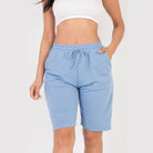 Women's light blue french terry bermuda shorts with drawstring waist and side pockets