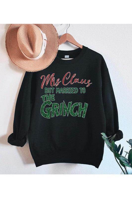 Funny Christmas sweaters by Color Bear featuring Mrs Claus but married to the Grinch in playful design