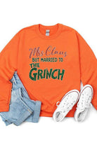 Funny Christmas sweaters featuring orange Mrs Claus design married to the Grinch with jeans and sneakers