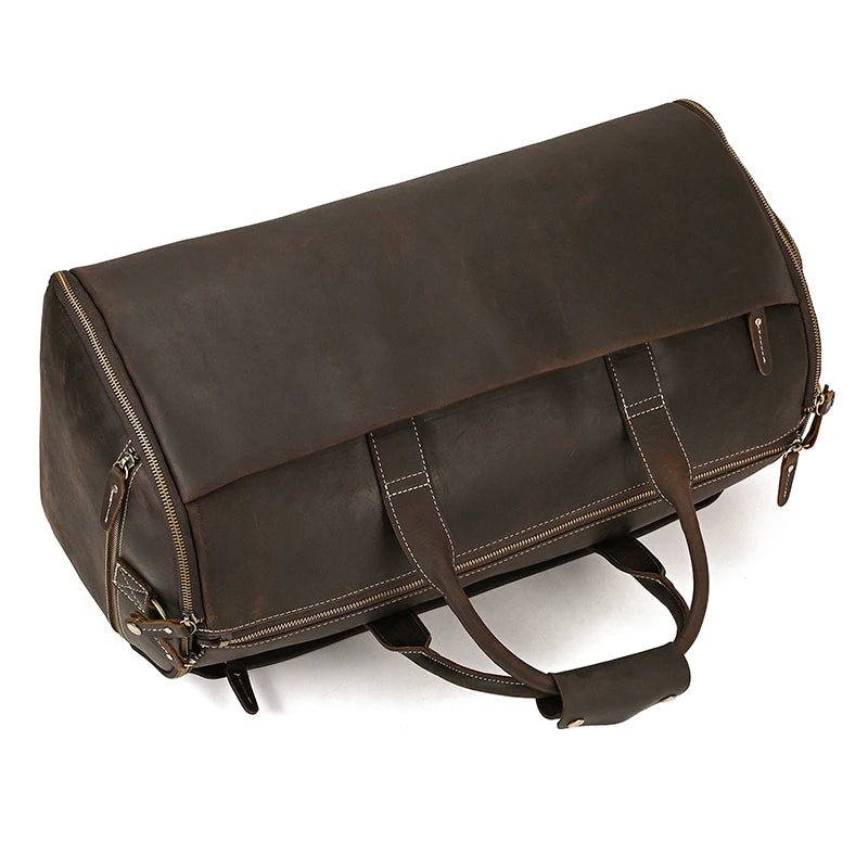 Brown leather garment bag for travel with sturdy handles