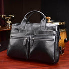 Black genuine leather briefcase with multiple zippered pockets for business professionals