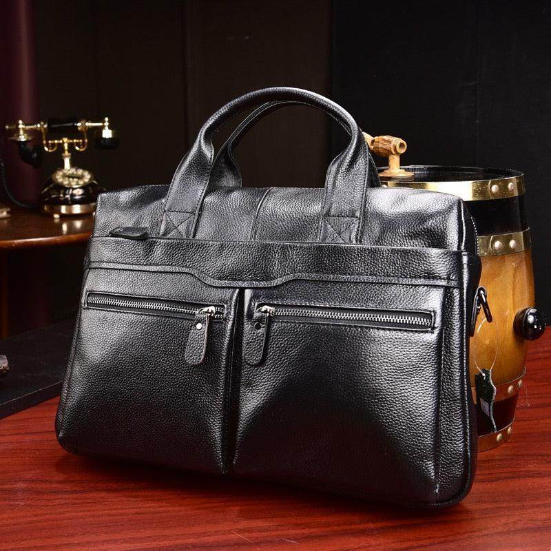 Black genuine leather briefcase with multiple zippered pockets for business professionals