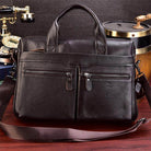 Genuine leather briefcase with top handles and multiple exterior pockets for organized storage