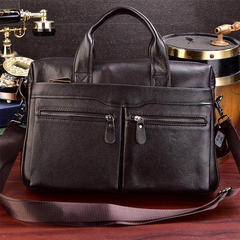 Genuine leather briefcase with top handles and multiple exterior pockets for organized storage