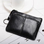Genuine leather coin wallet in black with a sleek design and convenient zipper closure