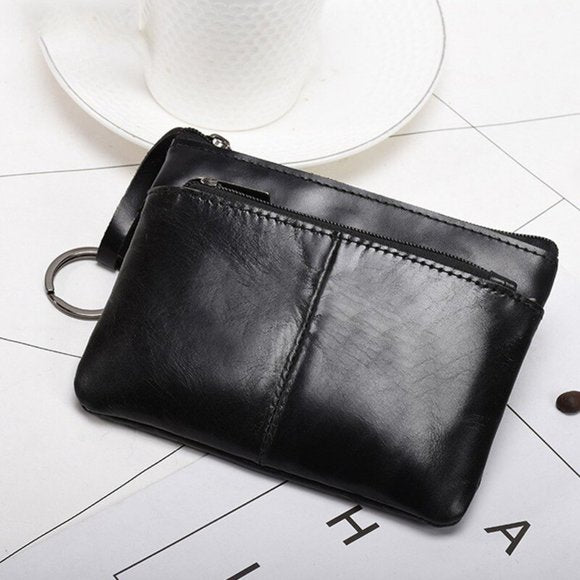 Genuine leather coin wallet in black with a sleek design and convenient zipper closure