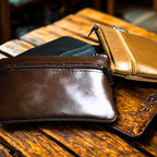 Genuine leather coin wallet in brown and gold colors, stylish and compact for everyday use