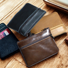 Assorted genuine leather coin wallets in various colors with zippered closures for secure storage