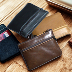 Assorted genuine leather coin wallets in various colors with zippered closures for secure storage