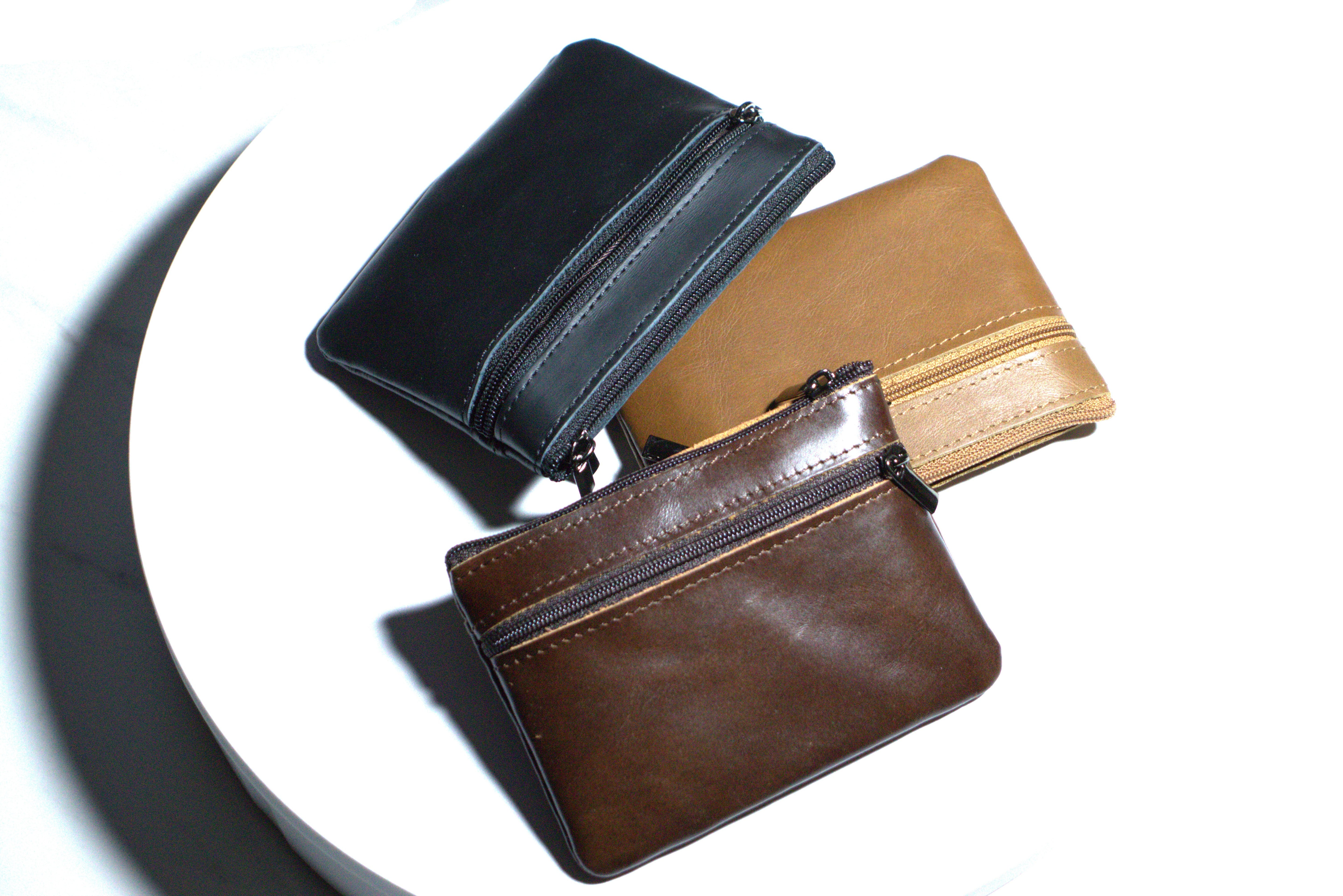 Assorted genuine leather coin wallet in black, brown, and tan colors for everyday use