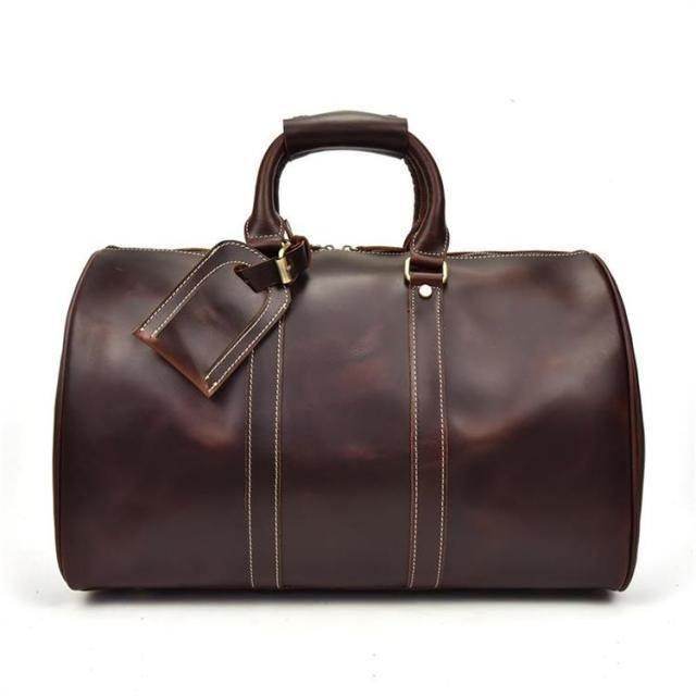 Brown genuine leather duffel bags with sturdy handles and stylish stitching for travel and gym use