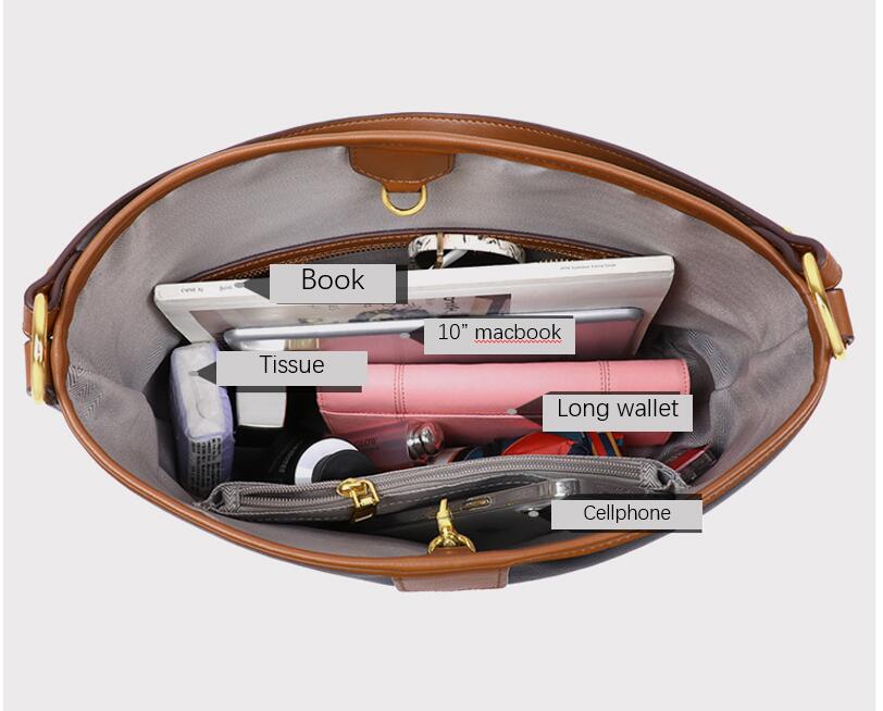 Inside view of a genuine leather hobo handbag showing spacious compartments for a laptop, wallet, and personal items