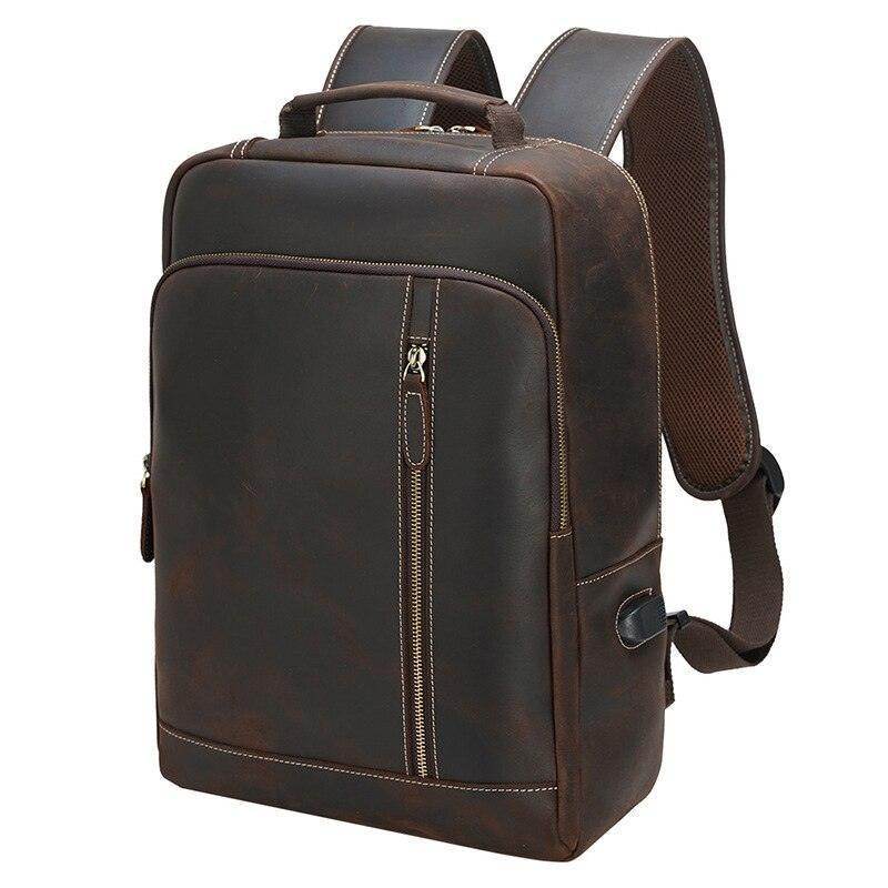 Genuine leather laptop backpack in dark brown with spacious compartments and comfortable straps