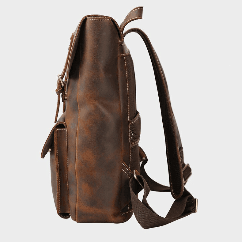 Side view of genuine leather mens travel backpack with adjustable straps and front pockets