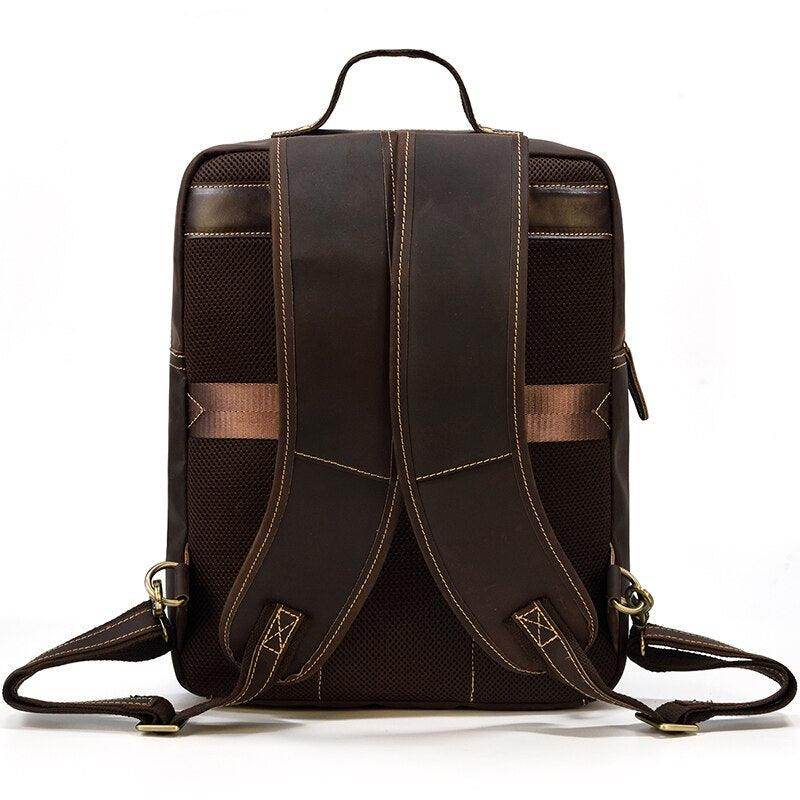 Genuine leather travel backpack in dark brown with padded back and adjustable shoulder straps