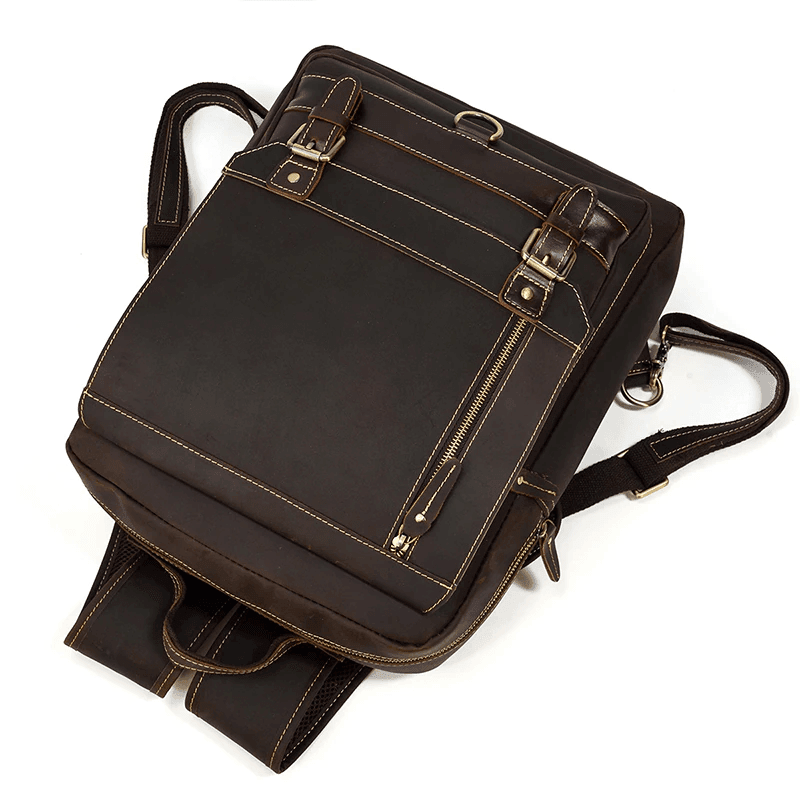 Genuine leather travel backpack with multiple pockets and adjustable straps for convenient carrying