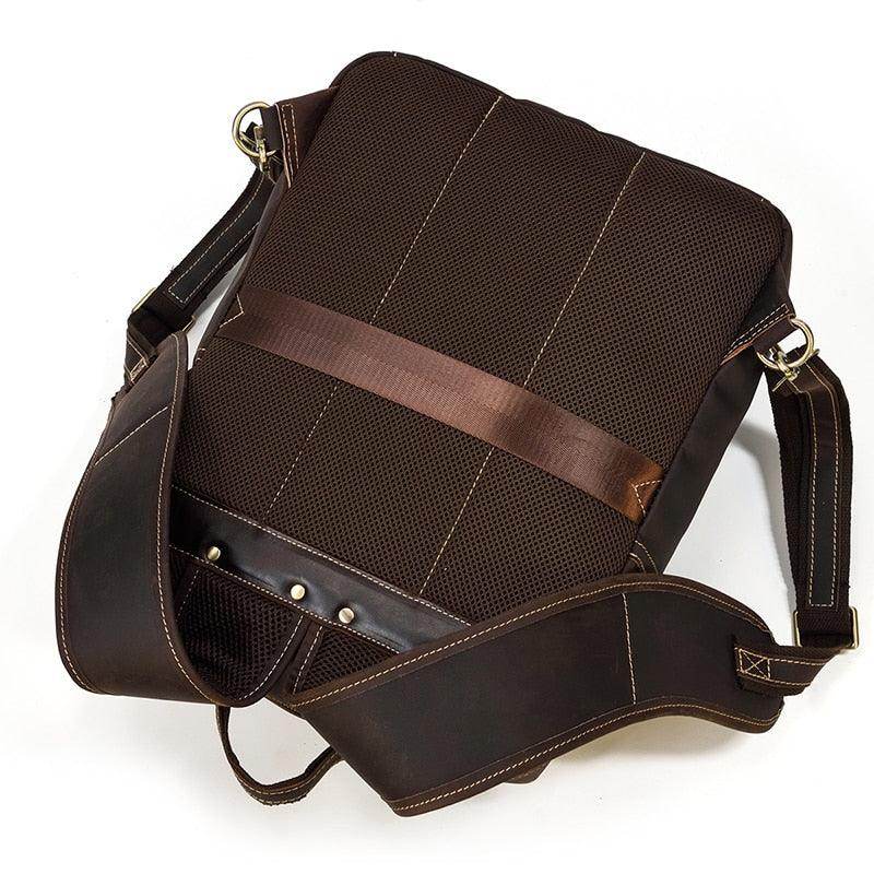 Genuine leather travel backpack in brown with adjustable shoulder strap and durable design