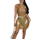 Gold glitter backless mini dress with halter neck and chain belt on woman holding white purse