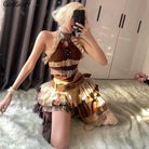 Punk vintage ruffle skirt outfit costume with layered belts and lace details worn by seated person