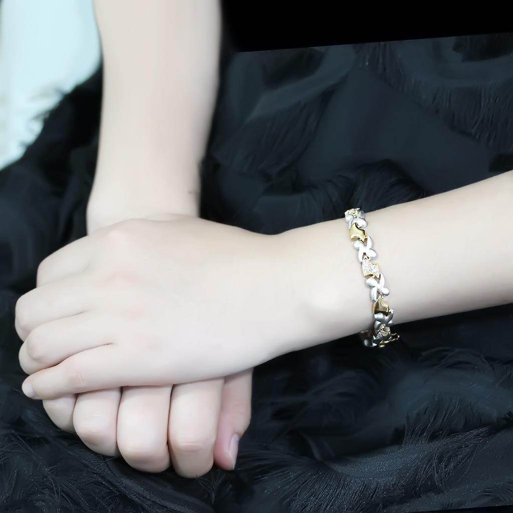 Gold and rhodium women's bracelet elegantly worn on a model's wrist for a stylish look