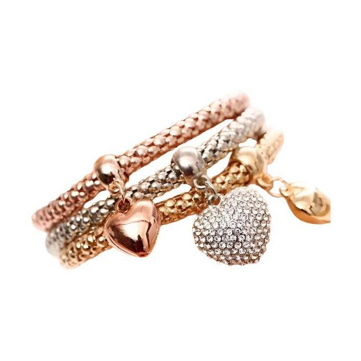 ClaudiaG Collection gold and silver bracelet set featuring braided designs and charming heart pendants