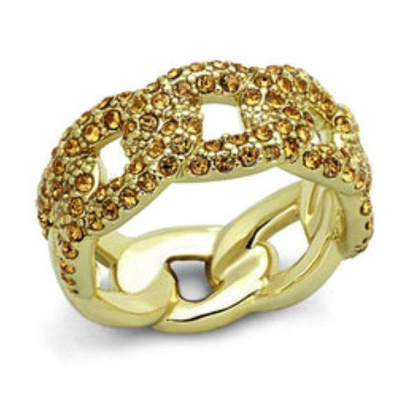 Gold brass smoked quartz ring featuring intricate link design and sparkling details
