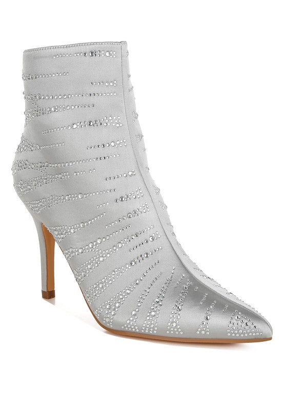Stylish gold embellished ankle boots with a sleek design and high heels for fashionable outfits