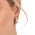 ClaudiaG Collection gold floral hoop earrings with intricate flower designs, perfect for stylish women