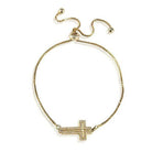 ClaudiaG Collection gold tone cross jewelry bracelet with sparkling detail and adjustable chain