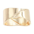 Stylish gold tone cuff bracelet with a unique twisted design for elegant accessorizing