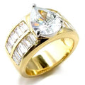 Gold tone teardrop engagement ring with a large teardrop crystal and baguette accent stones