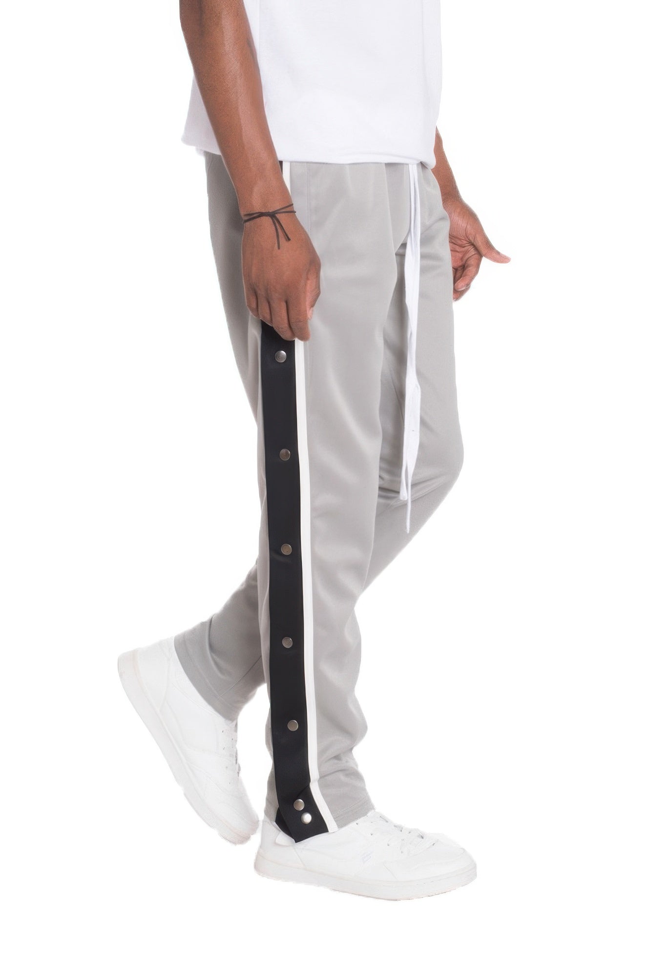 VacationGrabs men's snap button track pants joggers in gray with black side stripe and white sneakers