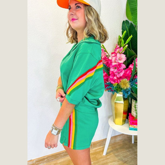 YNIQUE green colorblock lounge set with multicolor stripes worn by woman with casual cap