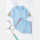 Light blue lounge set with red and rainbow stripes on sleeves and shorts edges green colorblock lounge set