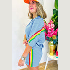 Woman wearing YNIQUE green colorblock lounge set with rainbow stripes on sleeves and skirt