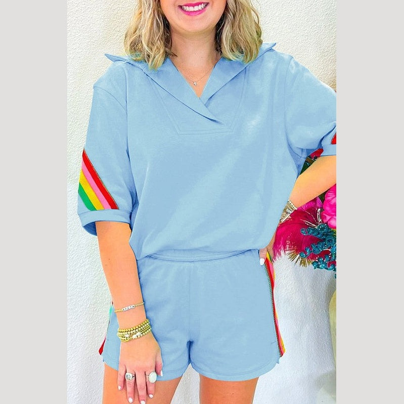 YNIQUE green colorblock lounge set featuring a casual short sleeve top and matching shorts with colorful striped accents