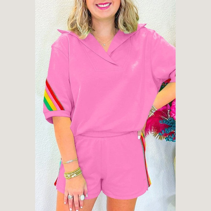 YNIQUE pink lounge set with colorful rainbow stripes on sleeves and shorts side in green colorblock lounge set style