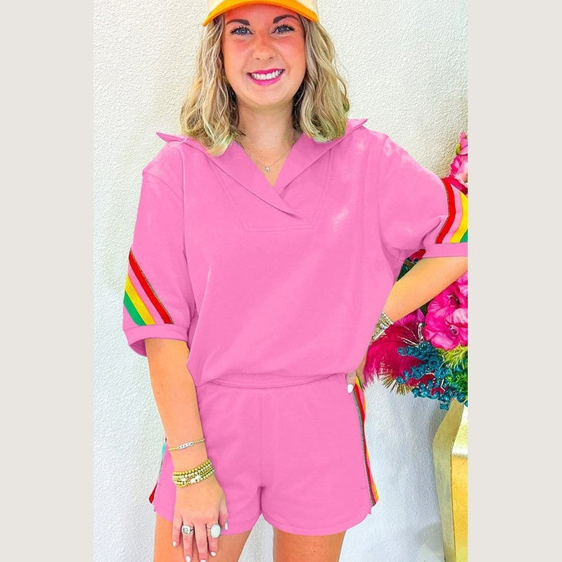 YNIQUE pink lounge set with rainbow stripes on sleeves and shorts featuring green colorblock lounge set