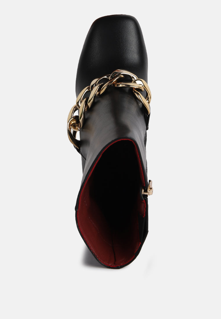 Stylish green platform ankle boots with a bold gold chain detail for trendy women